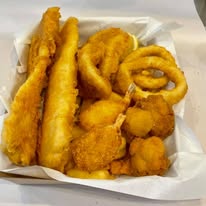 Mixed seafood box with fish, calamari and scallops